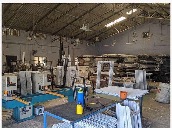 Saws and cut uPVC frames on the factory floor