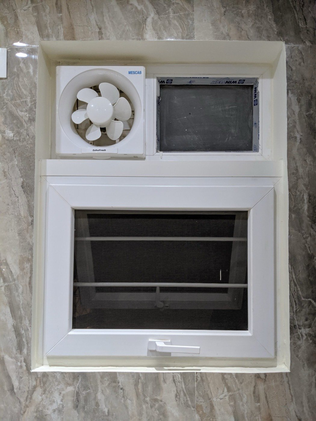 A white uPVC ventilator with grille, mesh and exhaust fan
